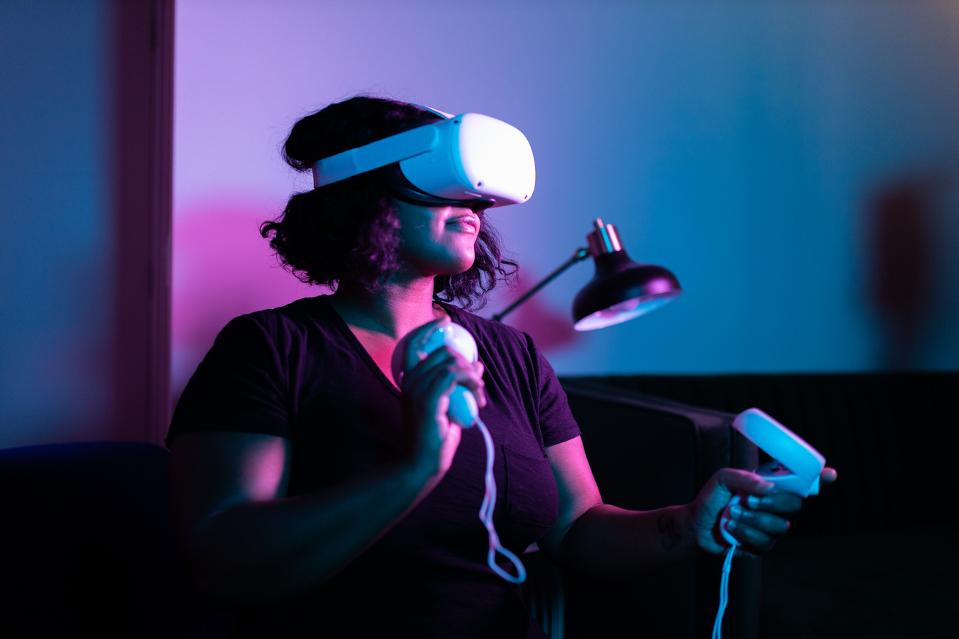 Woman Playing Online with VR Headset and Touch Controllers